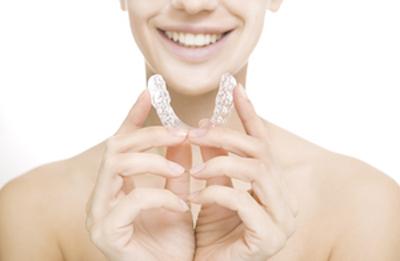 Woman holding a MouthGuard | Booragoon Dentist