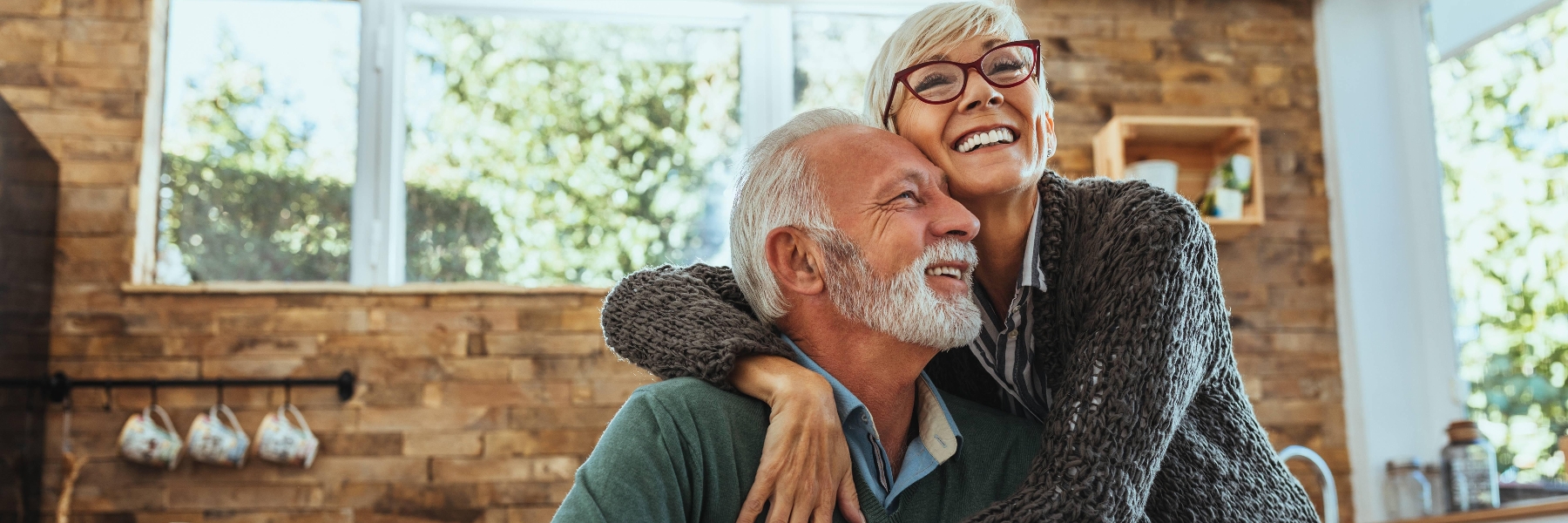 Couple sitting and smiling | Mount Pleasant Dentist