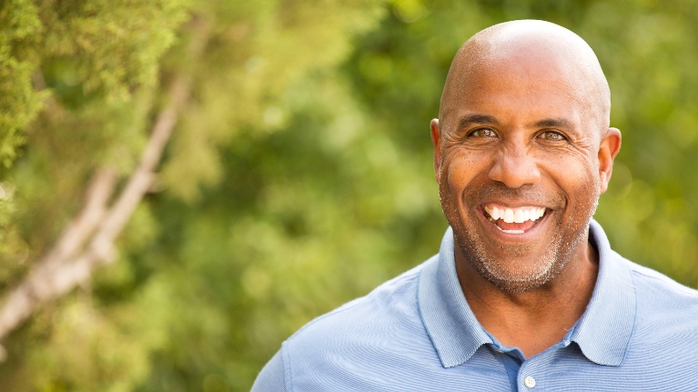 man with dental crowns smiling in booragoon