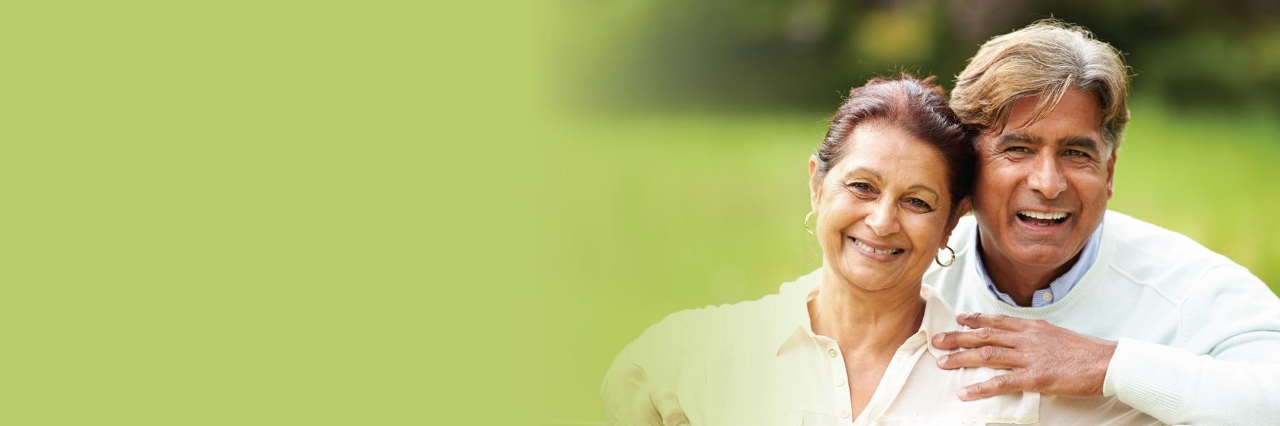 older man and woman smiling