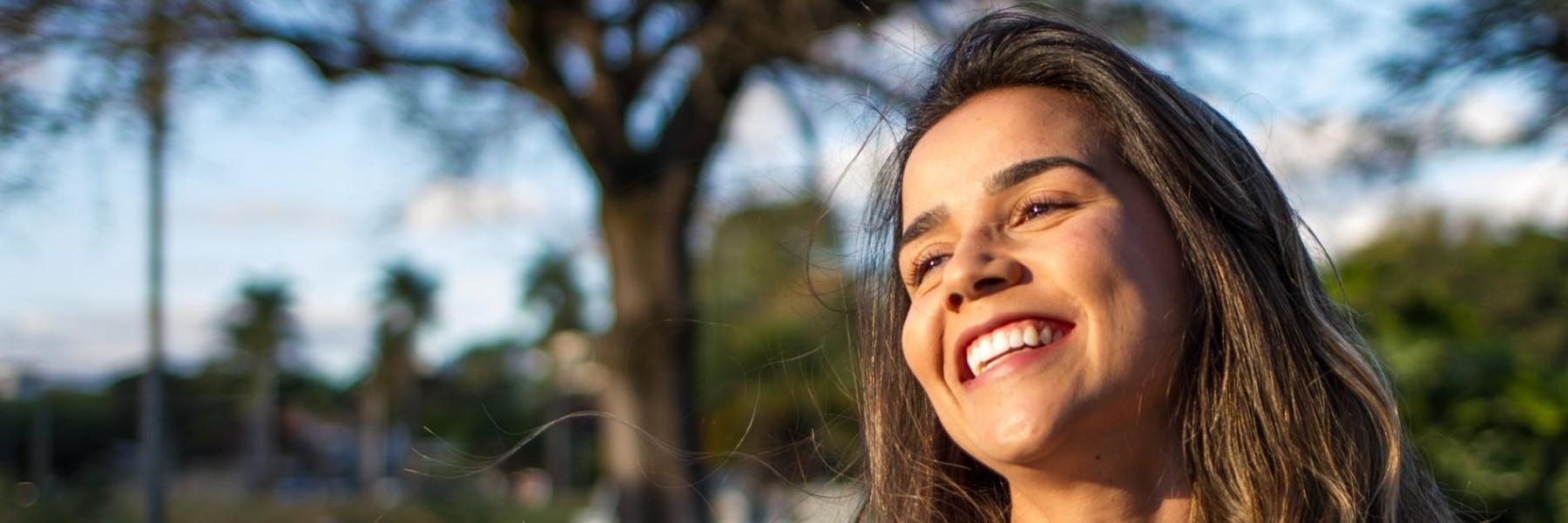 woman smiling while outside